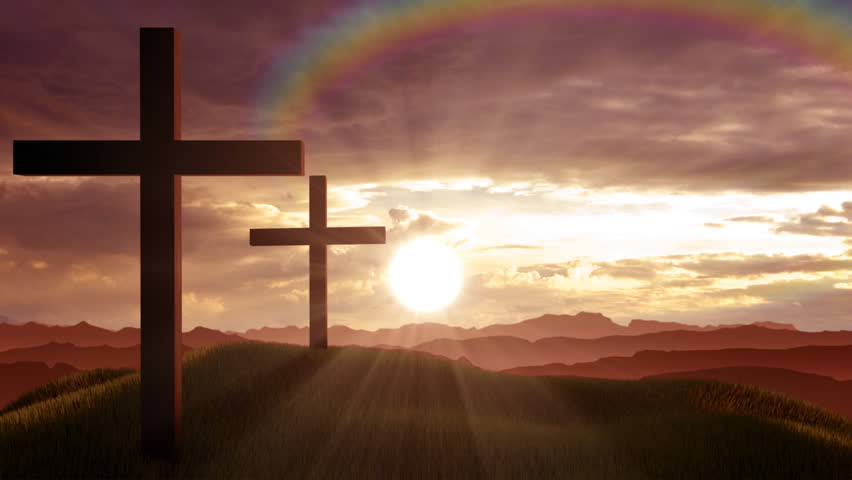 Christian crosses on a hill at sunset