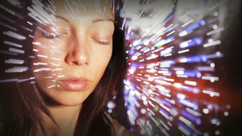 experimental stop motion clip of a beautiful woman dancing. the zoom ring of the lens is turned each time during a sequence of long exposed shot to achieve the light trails