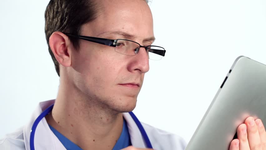 Doctor using tablet computer