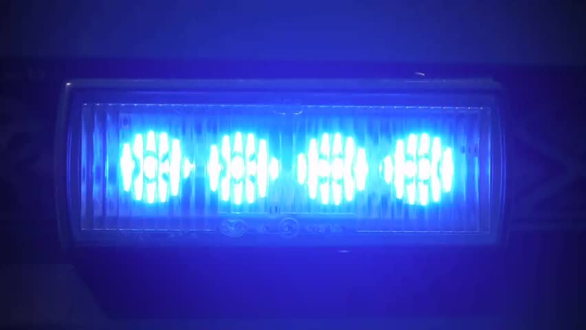 a flashing beacon from a German police car is shown 