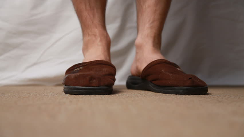 Putting slippers on
