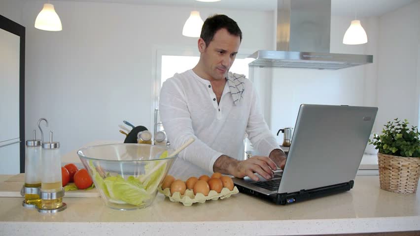Man checking recipe on internet