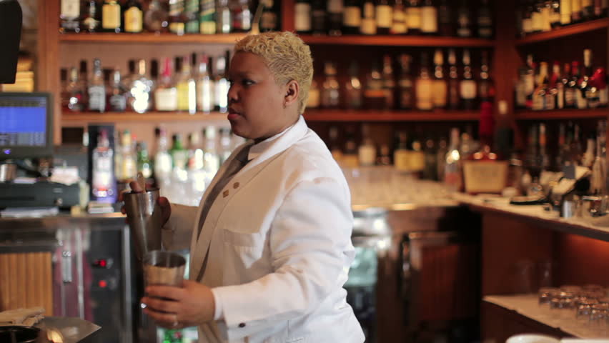 A series of model released clips featuring a female cocktail waiter in a classic looking cocktail bar in barcelona, Spain