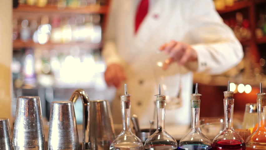 A series of model released clips featuring a male cocktail waiter in a classic looking cocktail bar in barcelona, Spain