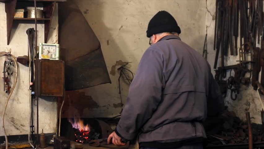 Fire of coal melting iron in Blacksmith Shop