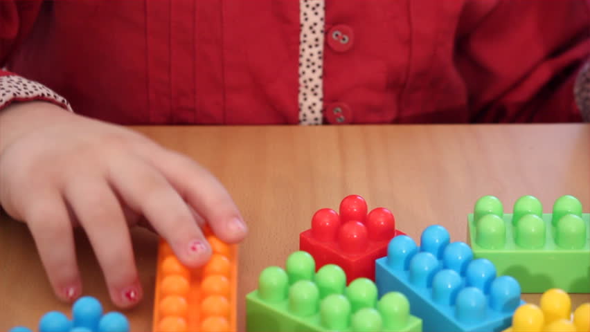 child play with toy brick