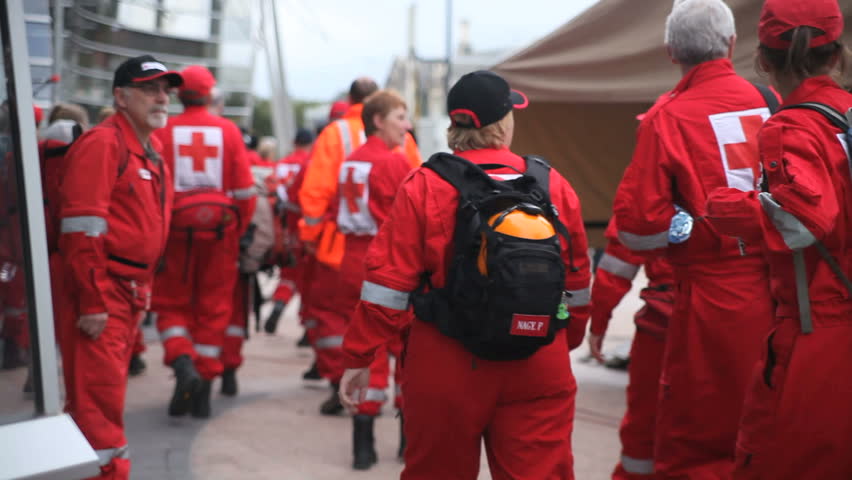 CHRISTCHURCH, NEW ZEALAND - FEB 23: Red Cross rescue workers return from search and rescue duty Feb 23rd, 2011. The Christchurch Earthquake devastated the city on Feb 22nd.