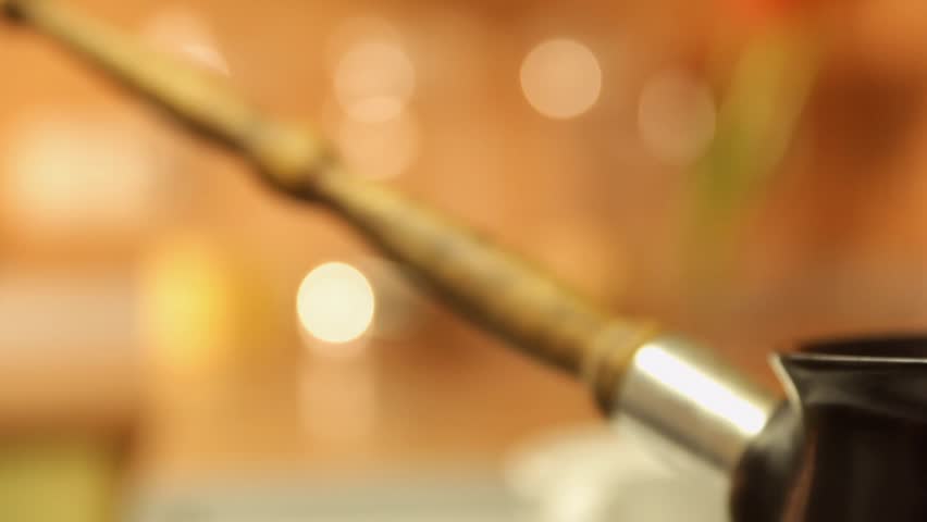 HD dolly: coffee boiling out from a coffee pot. Close-up
