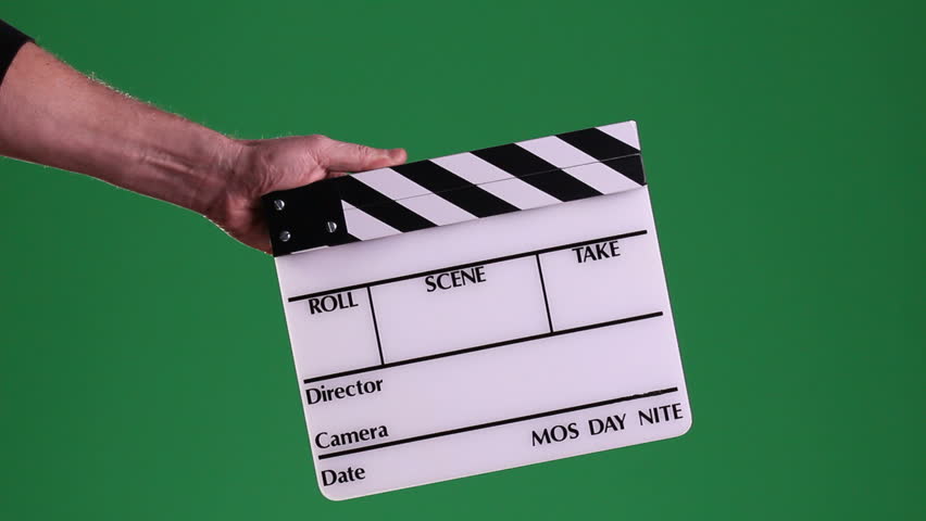 A motion picture clapboard, also called a slate, with hands snapping the stick on a green screen background