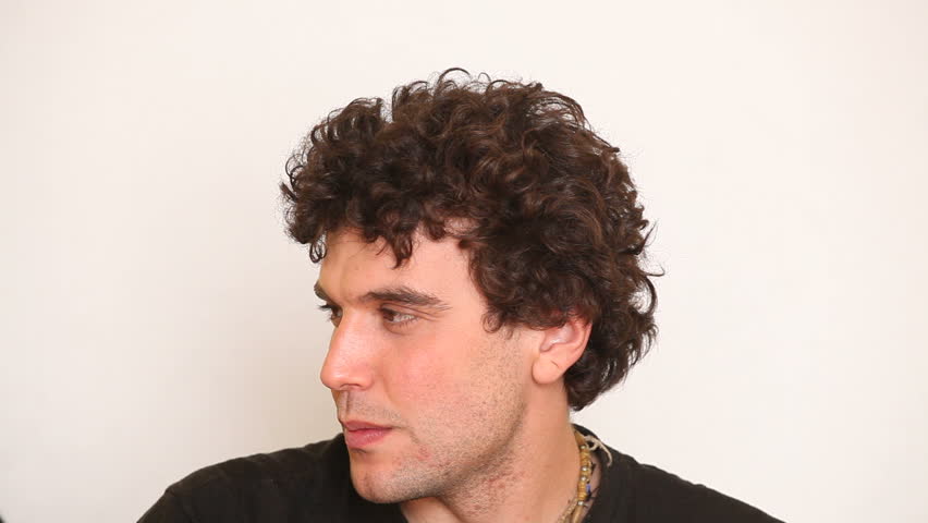 Young Man Caressing His Hairs
