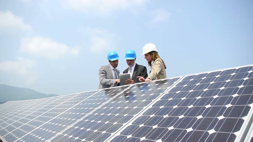 Engineers checking solar panels setup