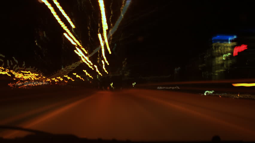 Hyper night drive. Timelapse clip assembled from photographic stills. Highway driving with a quick turnaround at an exit. All logos removed and/or blurred. QEW highway. Toronto, Ontario, Canada 