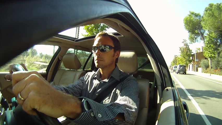 Man driving car along a road