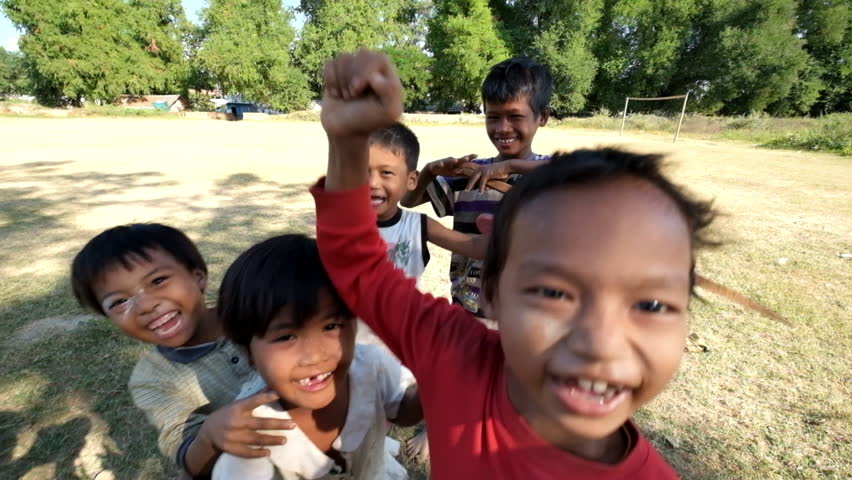 SARANKOT, NEPAL CIRCA OCTOBER 2011 Happy Nepali And Refugee Tibetan Children Pursuing The Camera ...
