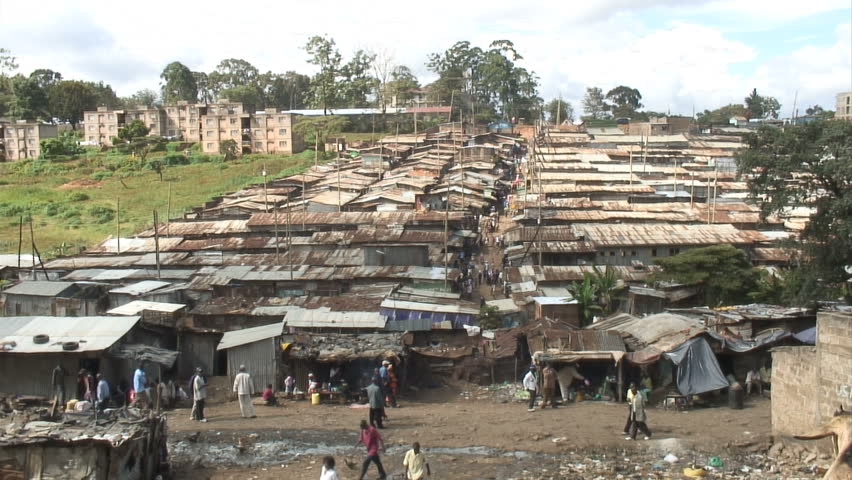 Busy Street and view over rooftops in African slum