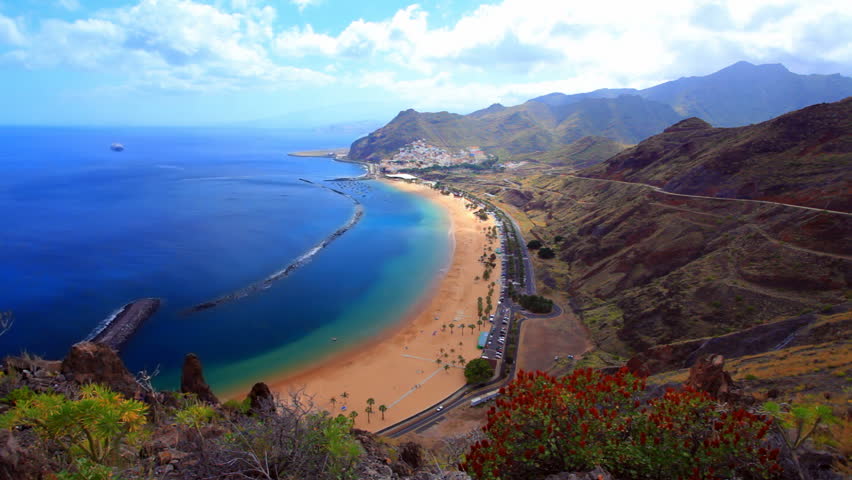 Gold sand beach Teresitas - Tenerife - Canary Islands - blue ocean, rocky mountains, fluffy clouds - timelapse