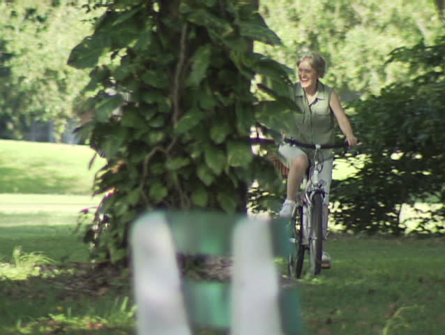 Mature Couple Riding Bike
