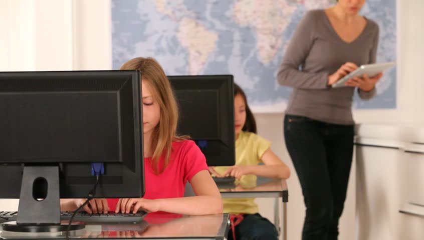 Teacher with kids in classroom