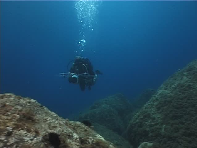 Underwater cameraman. Shot captured in the Mediterranean Sea (Italy) by 3CCD camera - PAL system.