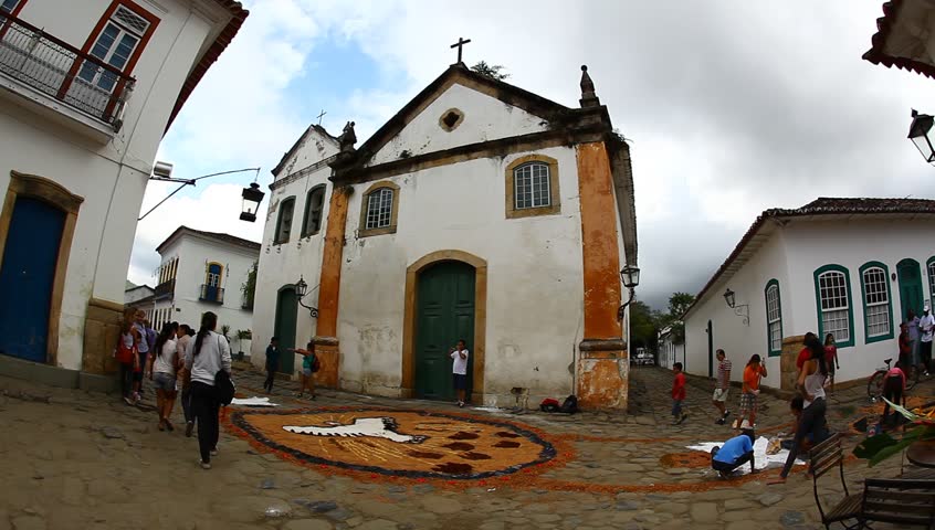 Catholics decorate cobble stone streets with tapestries made of colored sawdust, pigments, and flowers, before the procession of Corpus Christi in Paraty, Brazil. 