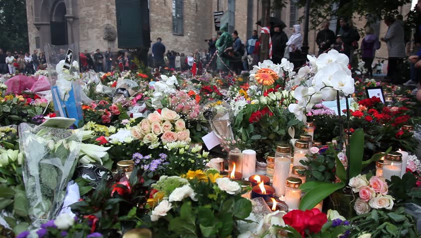 OSLO, NORWAY - CIRCA JULY 2011: People gather outside Domkirken church, near explosion site, to mourn the victims of 2011 Norway attacks in Oslo, Norway. The 2011 Norway terrorist attacks took place on Friday, July 22, 2011. 