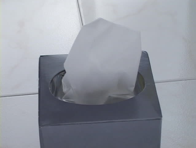 Hand grabs one tissue from tissue box