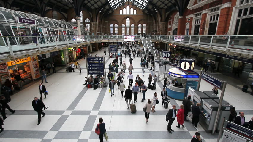 LONDON, UK - JULY 25: Train travelers walk through the central hall of Liverpool Street Station on July 25, 2011 in London, UK. Liverpool Street Station is the third busiest railway station of London.