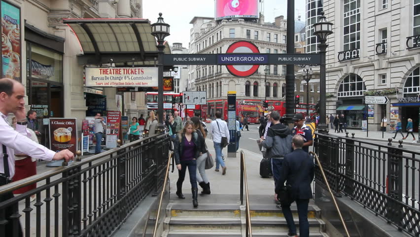 LONDON, UK - JULY 25: Commuters descend the stairs to the subway station in Oxford Street on July 25, 2011 in London, UK. The London subway is the oldest subway in the world and consists of 11 lines.