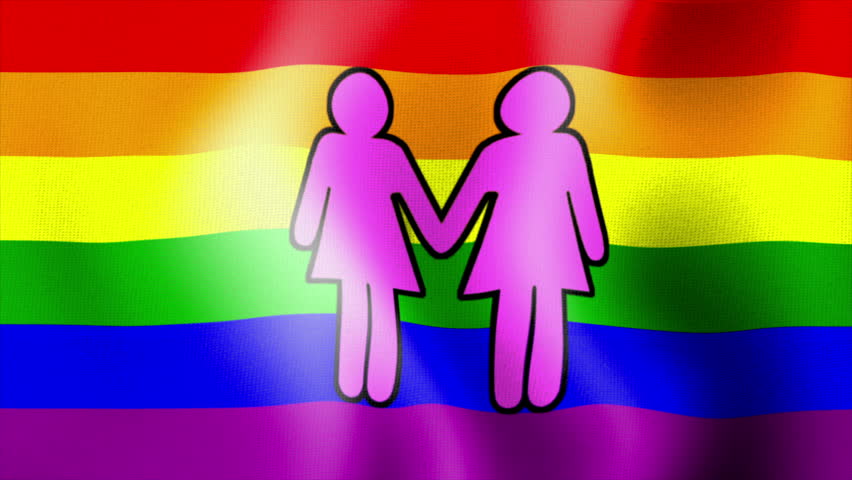 Waving rainbow flag with image of two females hand in hand