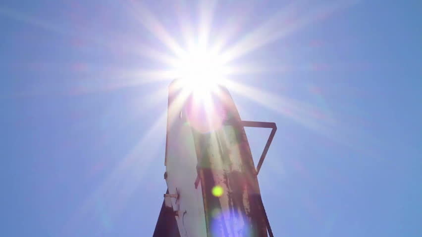 Crude oil pump jack with sunburst
