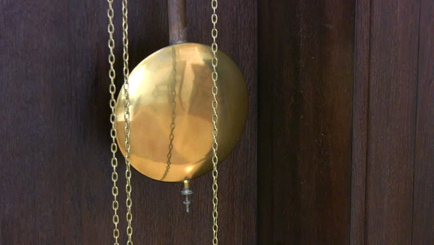 Pendulum of an antique grandfather clock.