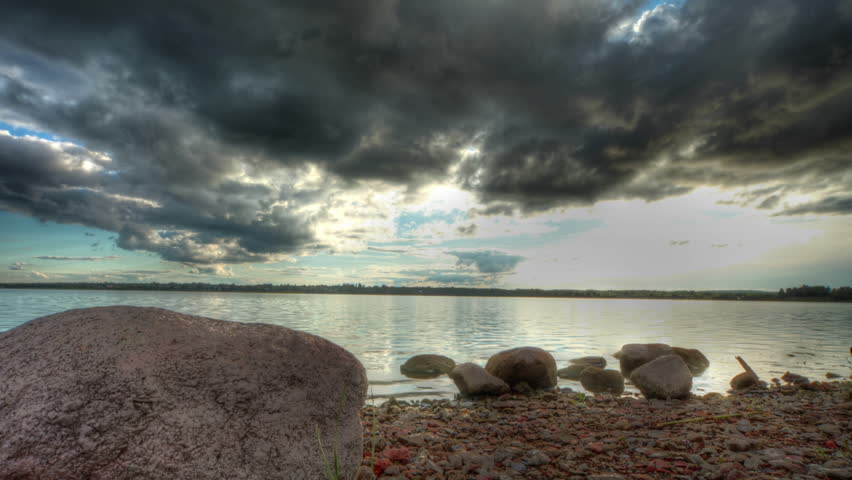Clouds over lake, HD time lapse clip, high dynamic range. imaging
