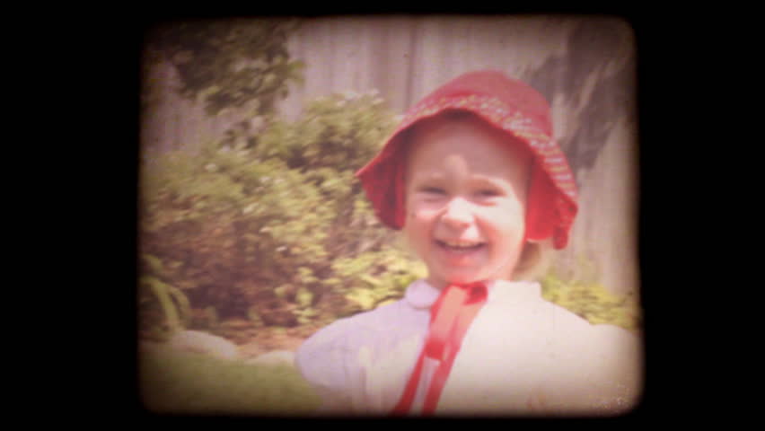 Old home movie of a family in their back yard with a vintage 8mm film look. Shot with my family recently, but very authentic looking. Includes projector audio.