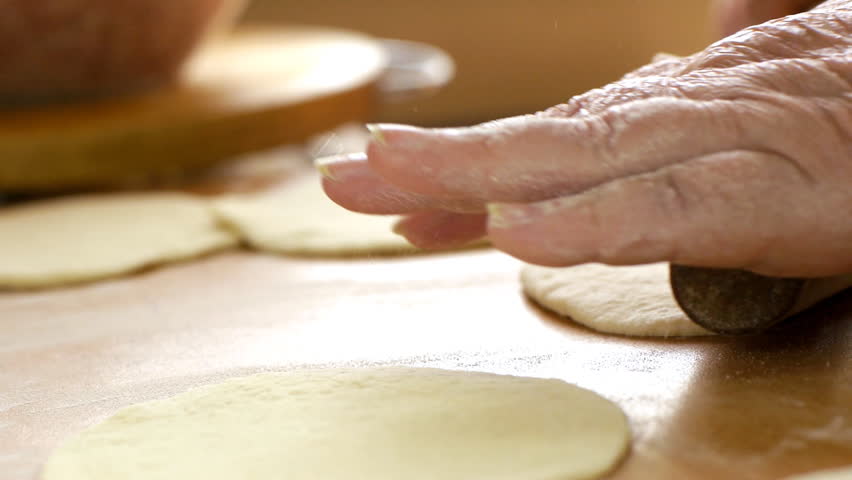 Rolling out the paste and cooking. Sequence of shots.
