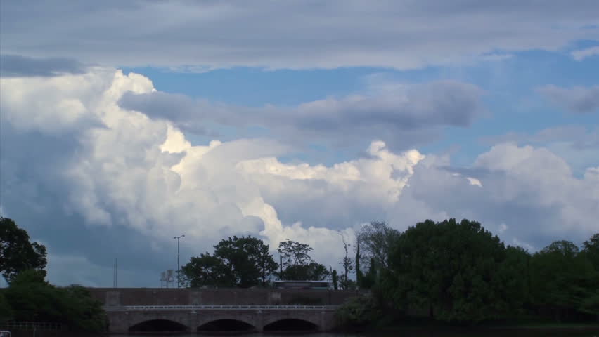 Timelapse footage of clouds in a blue sky
