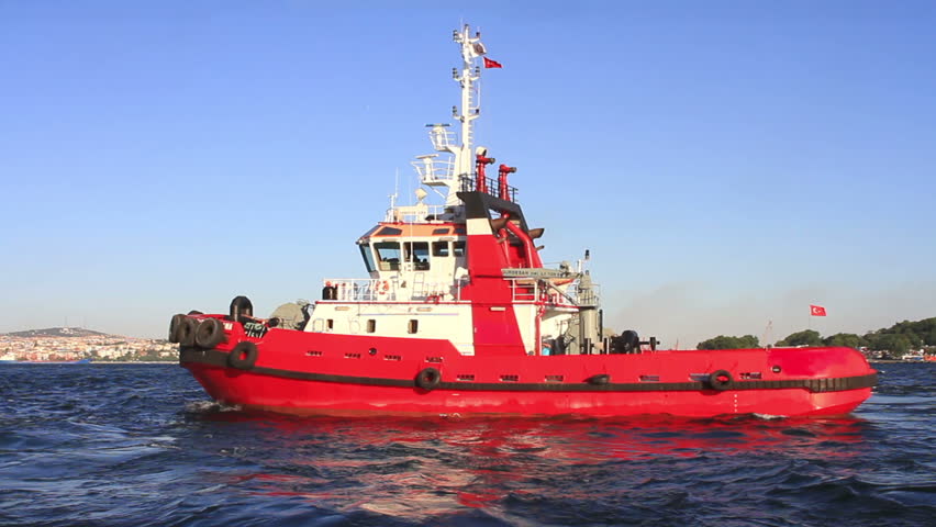 Pilotage service boat in front of harbor. 