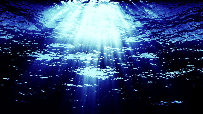From under blue water, blue light streaks down.