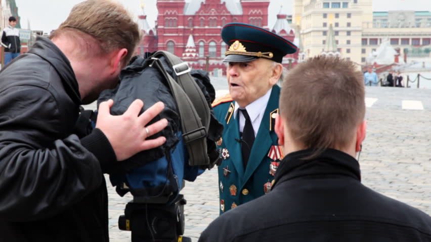 MOSCOW - APRIL 24: Journalists take interview in war veteran in Red Square on April 24, 2010 in Moscow, Russia. More than 100 million military personnel was mobilized in World War II