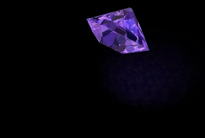 Infinite rotating, shining and in nice rainbow-colors refracting pure-violet  Diamond-Gemstone.