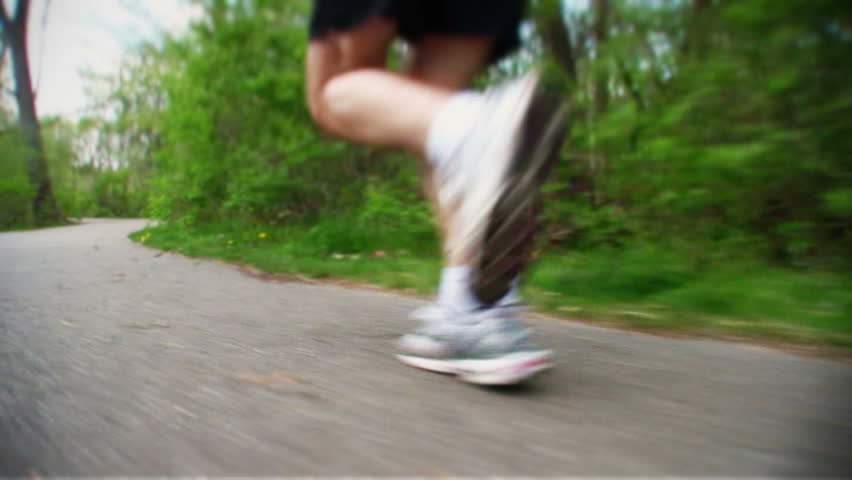 Close-up of jogger's legs