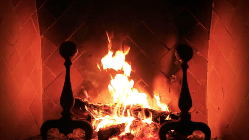 Static slow motion shot tight on fireplace