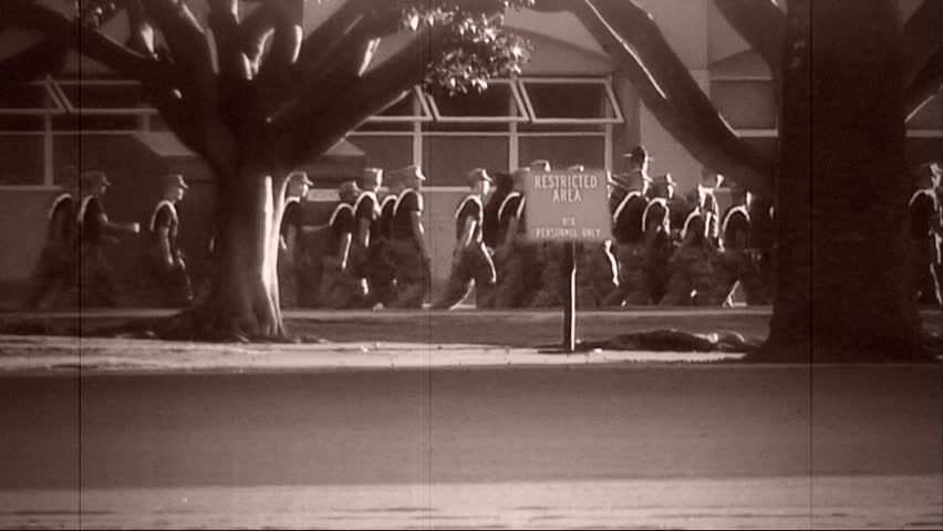 Archival shot of Marine formations marching