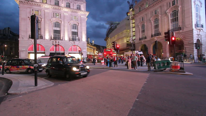  LONDON, UK - JULY 25: Traffic and pedestrians on Piccadilly Circus in the evening on July 25, 2011 in London, UK. Piccadilly Circus is a road junction and public space of London's West End in the City of Westminster, built in 1819 to connect Regent Stree
