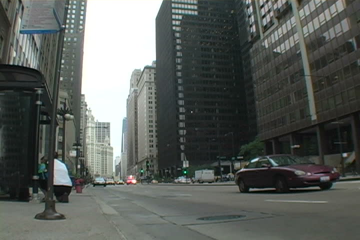Ambulance in downtown Chicago passing by sirens blaring.