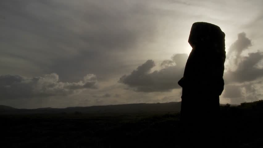 Time lapse of amazing clouds with Easter Island statues in silhouette.
