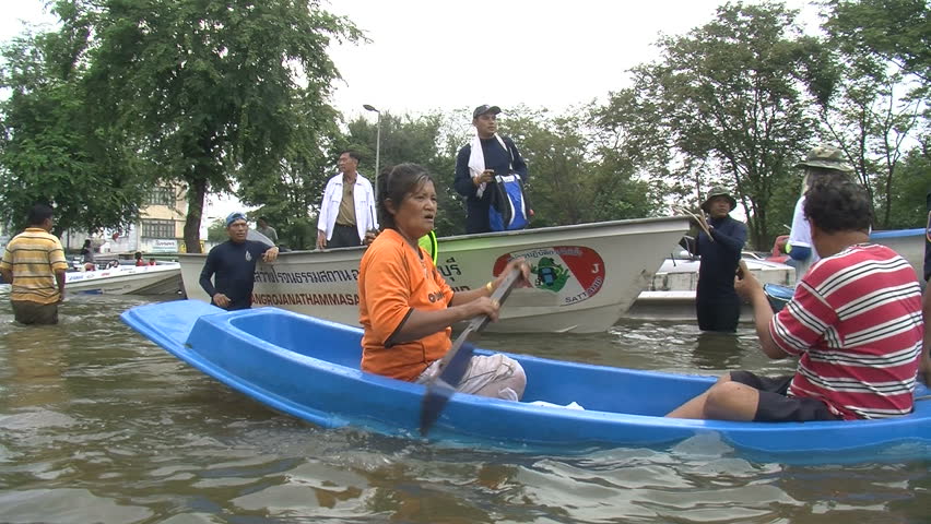 AYUTTHAYA, THAILAND - OCTOBER 12: Floods inundate city residents on October 12, 2011, Ayutthaya, Thailand. Parts of Thailand are now experiencing the worst floods in half a century, as water inundates villages, historic temples, farms, and factories.