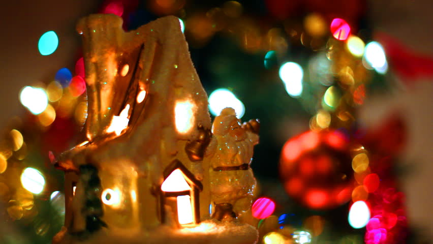 fabulous toy house with Santa Claus near Christmas tree and colorful garlands