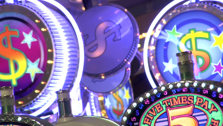 Spinning money signs above some slot machines in a casino in Las Vegas.