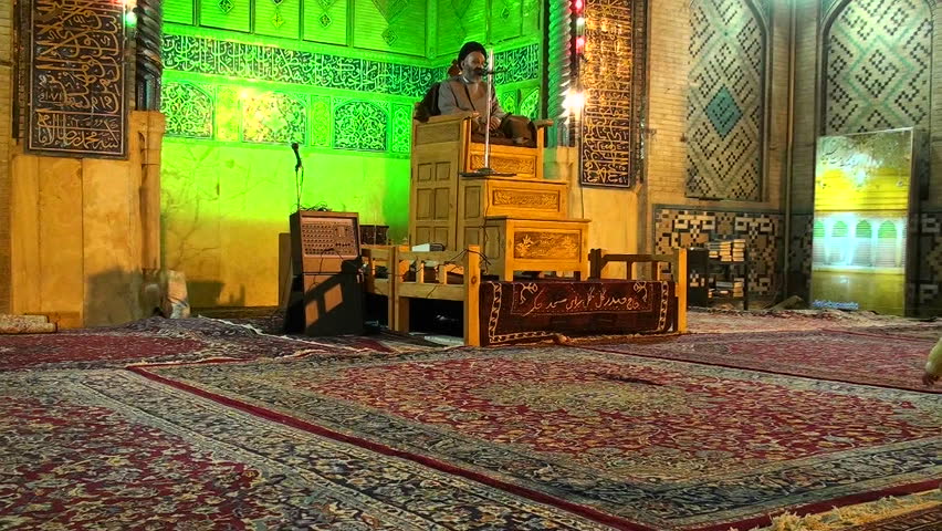 IRAN - CIRCA 2010: A religious leader speaks to followers in a mosque circa 2010 in Iran.