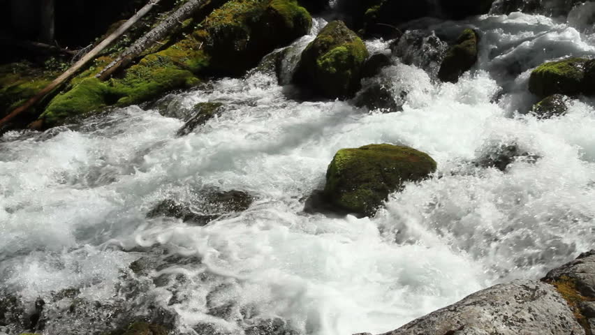 Pan of stream coming from underground source